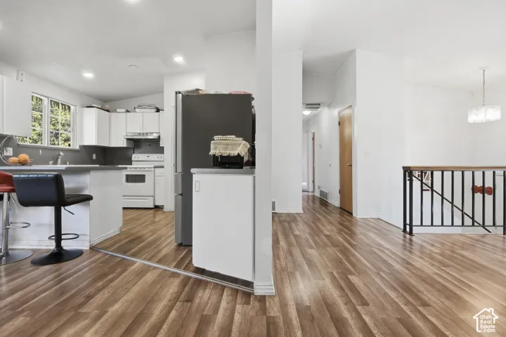 Open-concept layout with wood-finish flooring