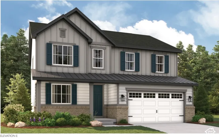 Two-story residence featuring a dark-toned roof, light gray siding, decorative shutters, a two-car garage, and stone accents