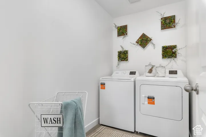 Laundry area featuring a side-by-side washer and dryer