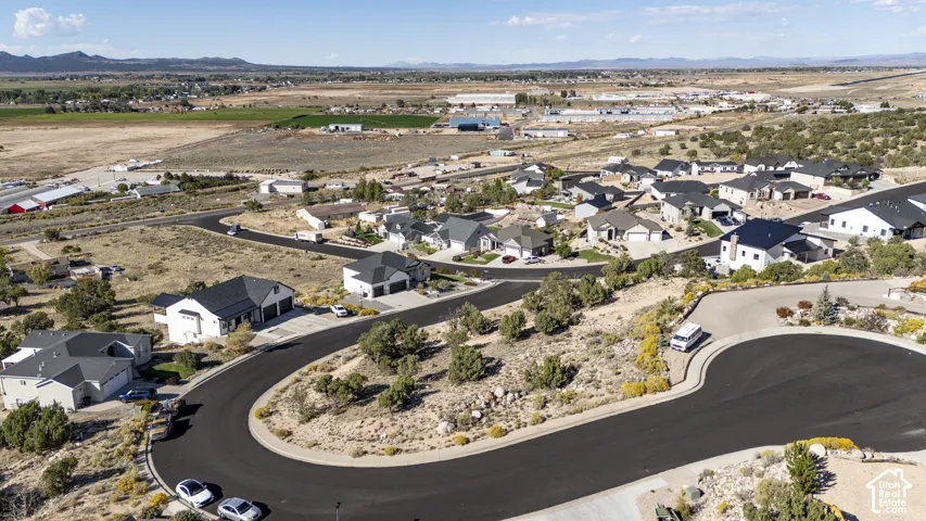 Residential development with paved roads and mature desert landscaping