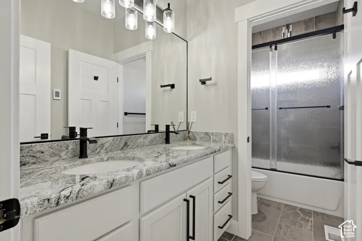 Dual vanity with integrated sinks and a stone-finish countertop