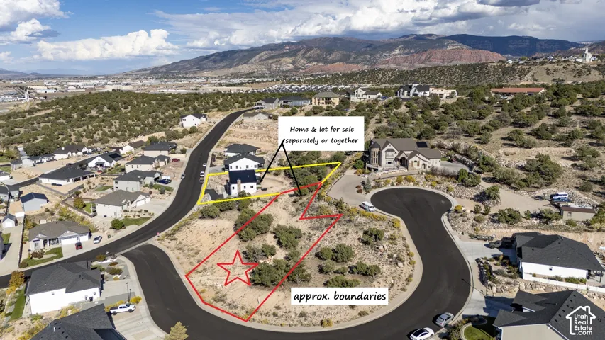 Aerial perspective of a multi-parcel lot featuring natural desert landscaping and mountain backdrops