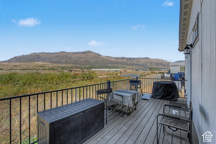 Expansive outdoor deck with composite decking and black metal railing