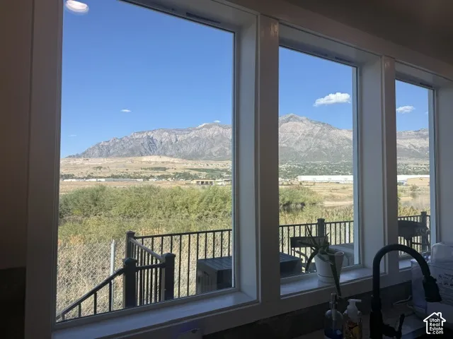 Expansive windows provide abundant natural light and scenic mountain and landscape views