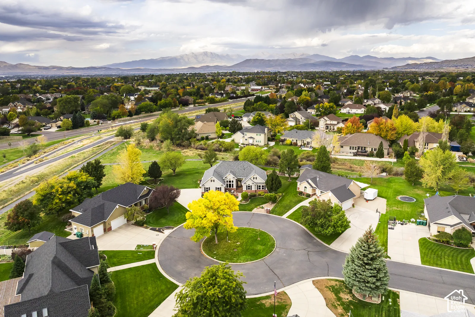 Cul-de-sac setting with manicured lawns and mature trees