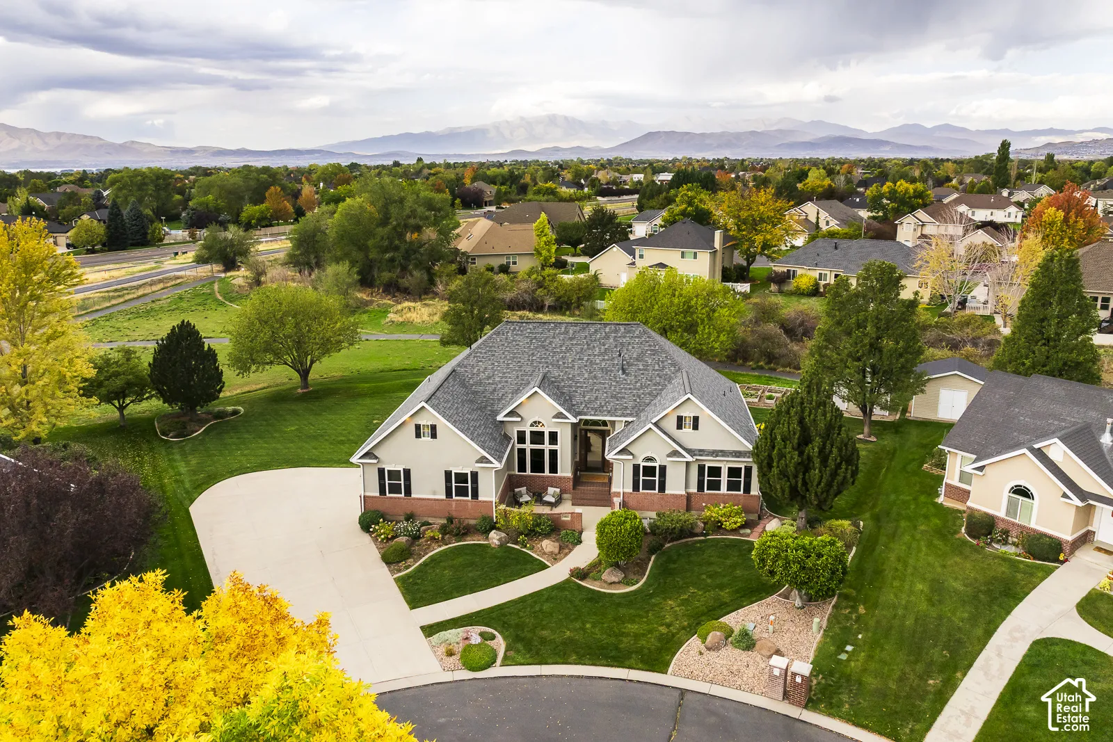 Expansive landscaped grounds with mature trees