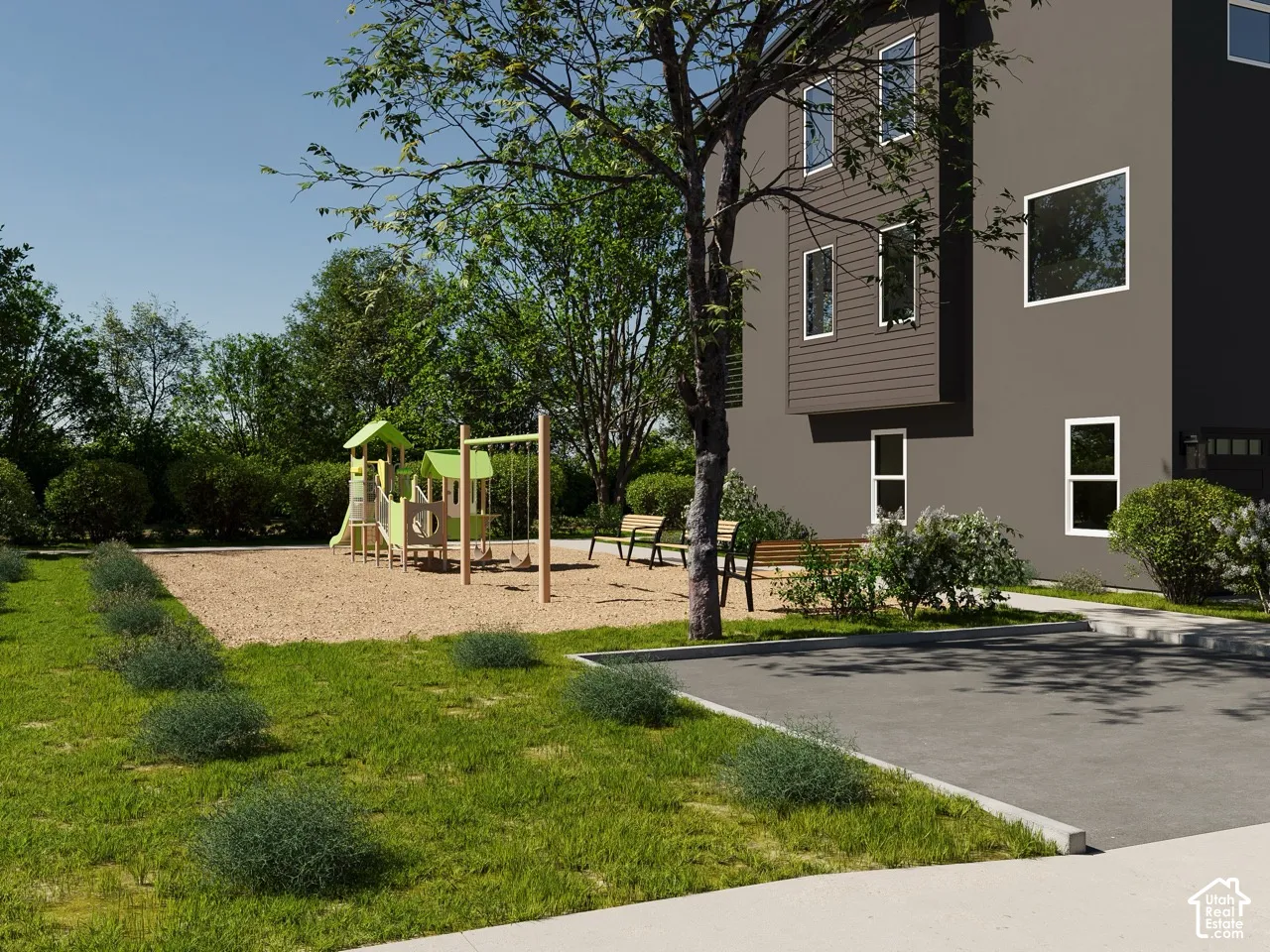 Modern exterior with a contrasting architectural element, multiple windows, and integrated garage