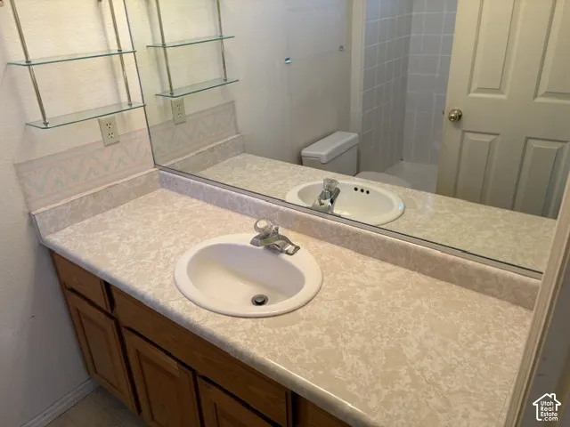 Vanity with a full-width wall mirror