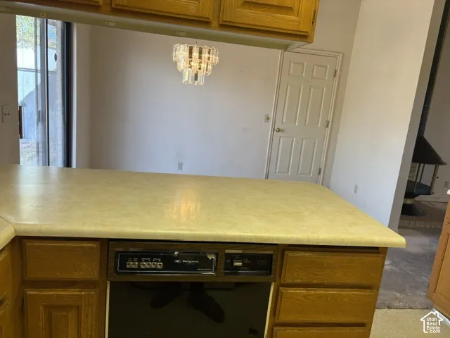 Kitchen island with a laminate countertop and built-in dishwasher