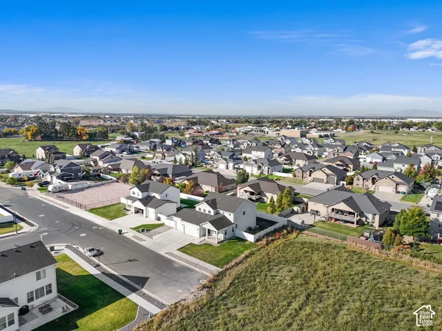 Residential neighborhood with varied architectural styles and surrounding open spaces