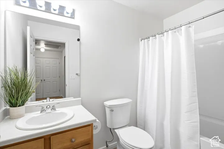 Upstairs main bathroom with brand new vinyl flooring and tub surround