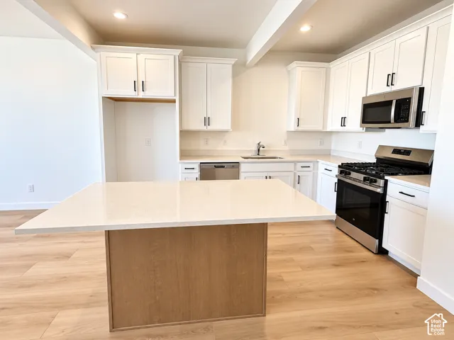 Kitchen with spacious island with space for barstools on 3 sides