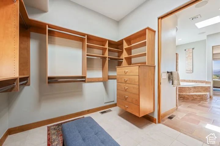 Custom wood-finish closet system with integrated shelving and drawers