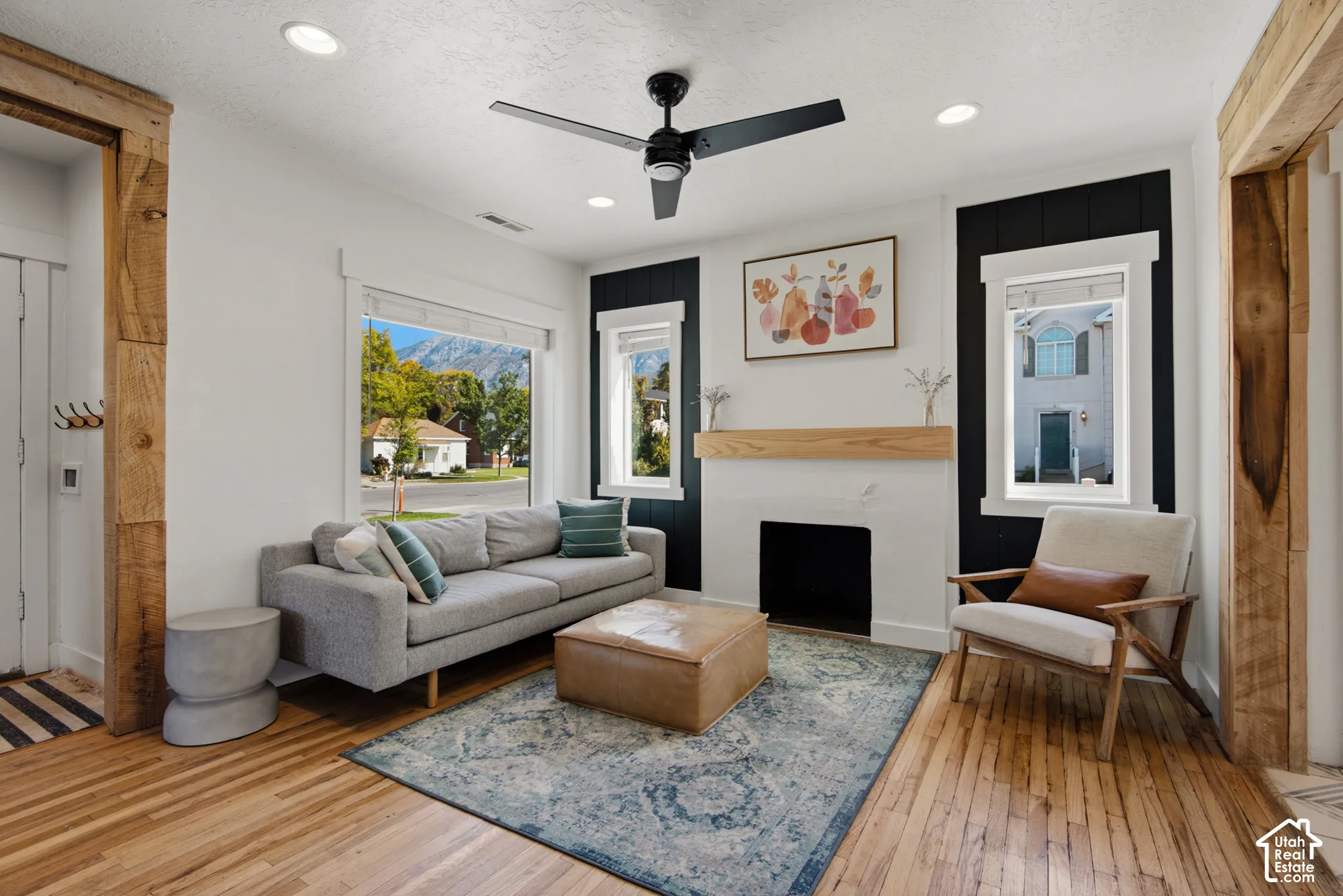Hardwood flooring, recessed lighting, and a modern ceiling fan
