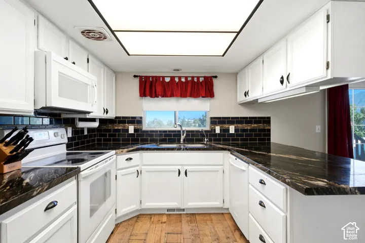 The natural granite countertops are stunning with beautiful movement in the patterns.
