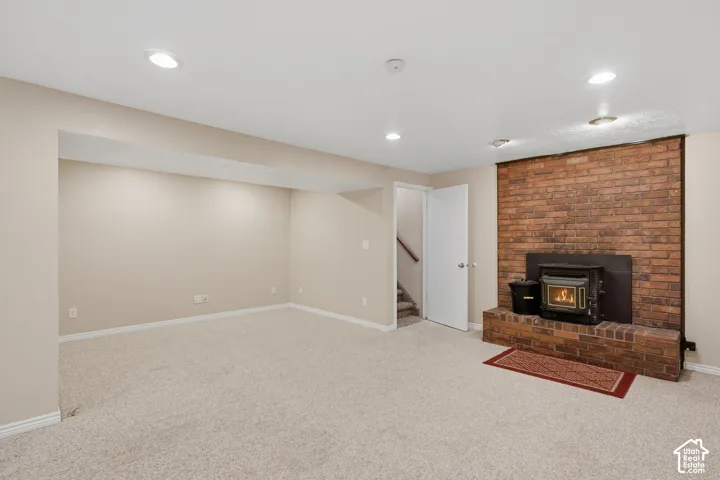 FAMILY ROOM WITH WOOD BURNING STOVE (pellet stove, but not working for pellets currently) There is a large nook here that I have seen closed off and made into a theatre room!