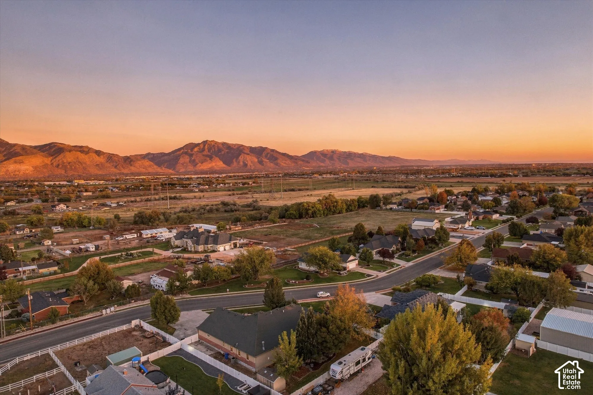 Aerial perspective featuring mountain backdrops and expansive open terrain