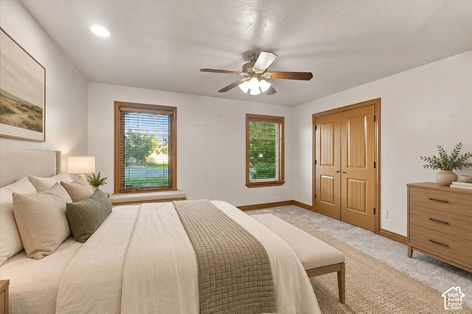 Double-pane windows with wood trim, integrated window seating, recessed lighting, multi-speed ceiling fan, and paneled wood closet doors