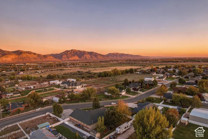 Aerial perspective featuring mountain backdrops and expansive open terrain