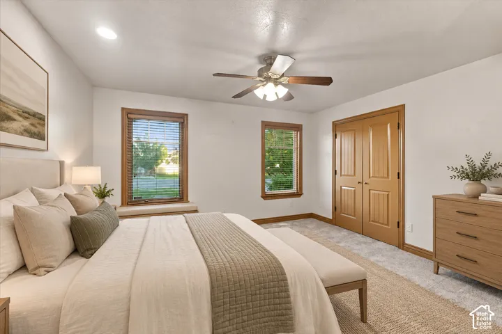 Double-pane windows with wood trim, integrated window seating, recessed lighting, multi-speed ceiling fan, and paneled wood closet doors