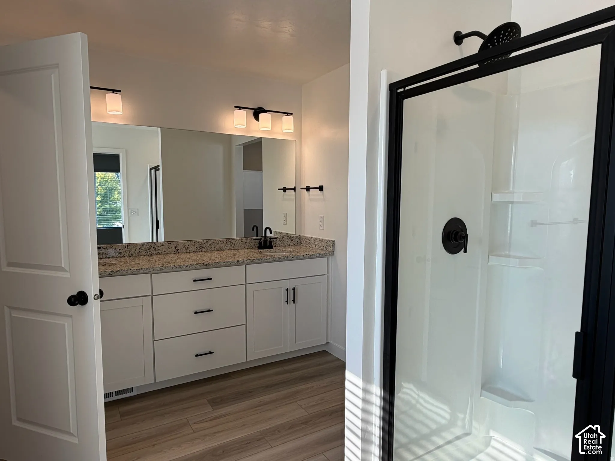 Owner's bathroom Dual vanity with a stone countertop and undermount sinks