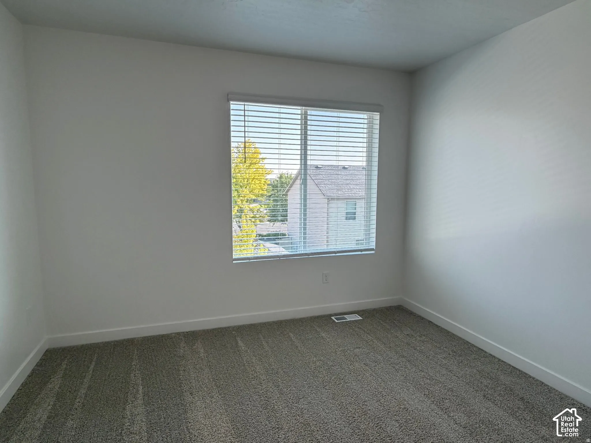 Bedroom #2 Window with blinds, wall-to-wall carpeting, and white painted walls