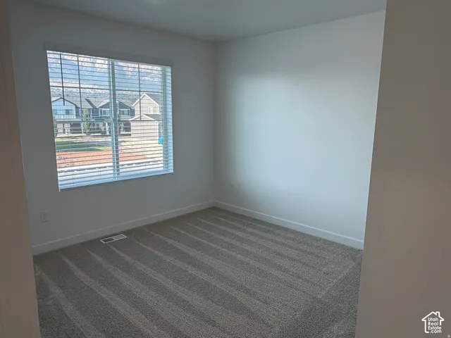 Bedroom #3  with Carpeted flooring, white walls, and a window with horizontal blinds