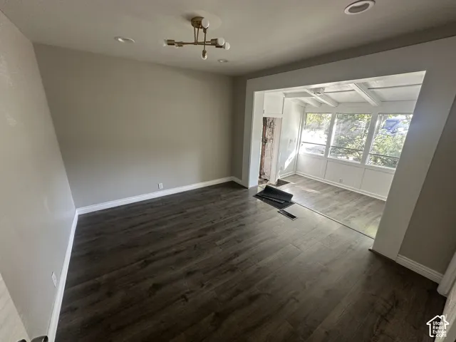 Wood-finish flooring throughout, recessed lighting, and a modern ceiling fixture