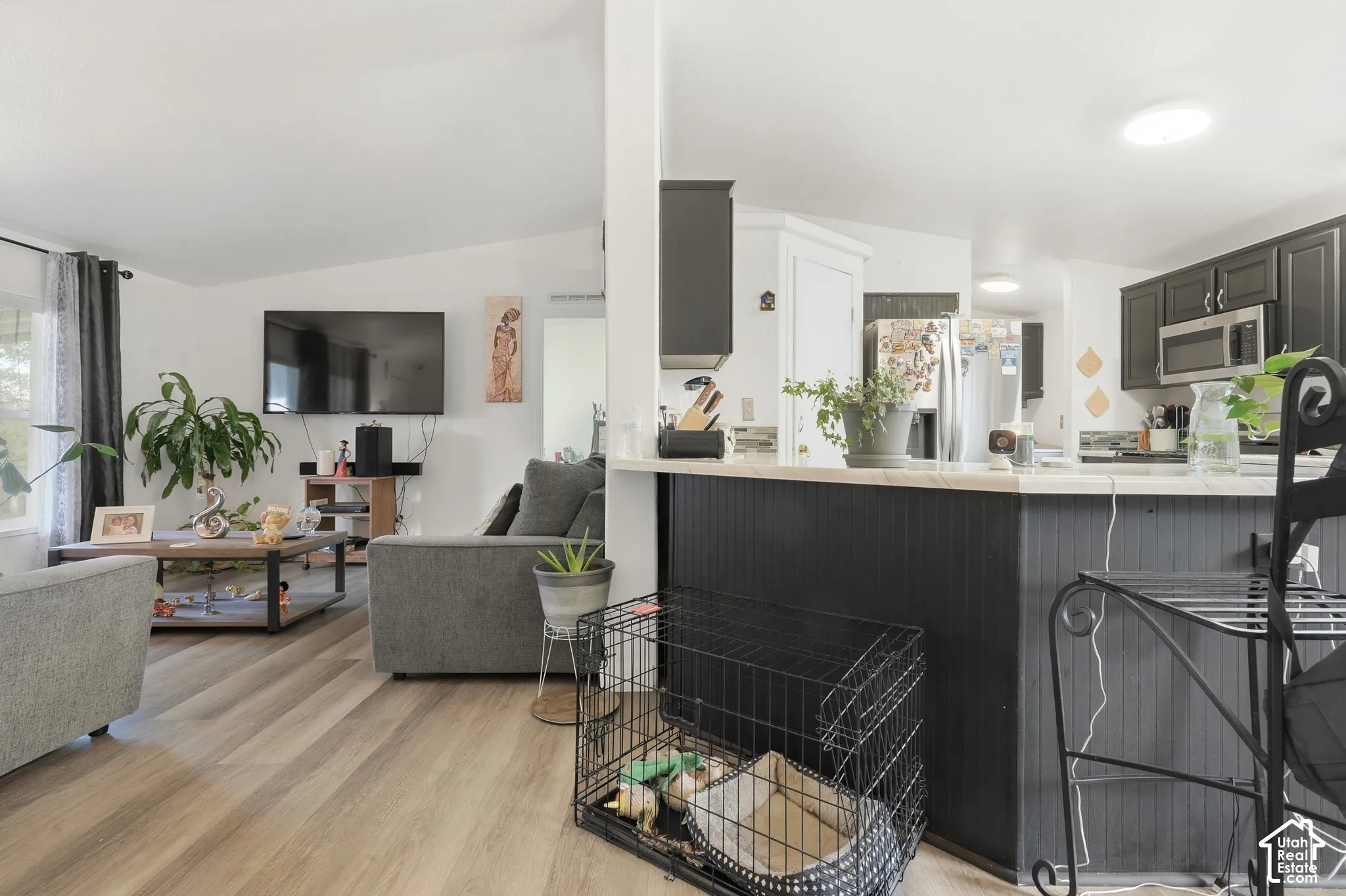 Open-concept living space with wood-finish flooring