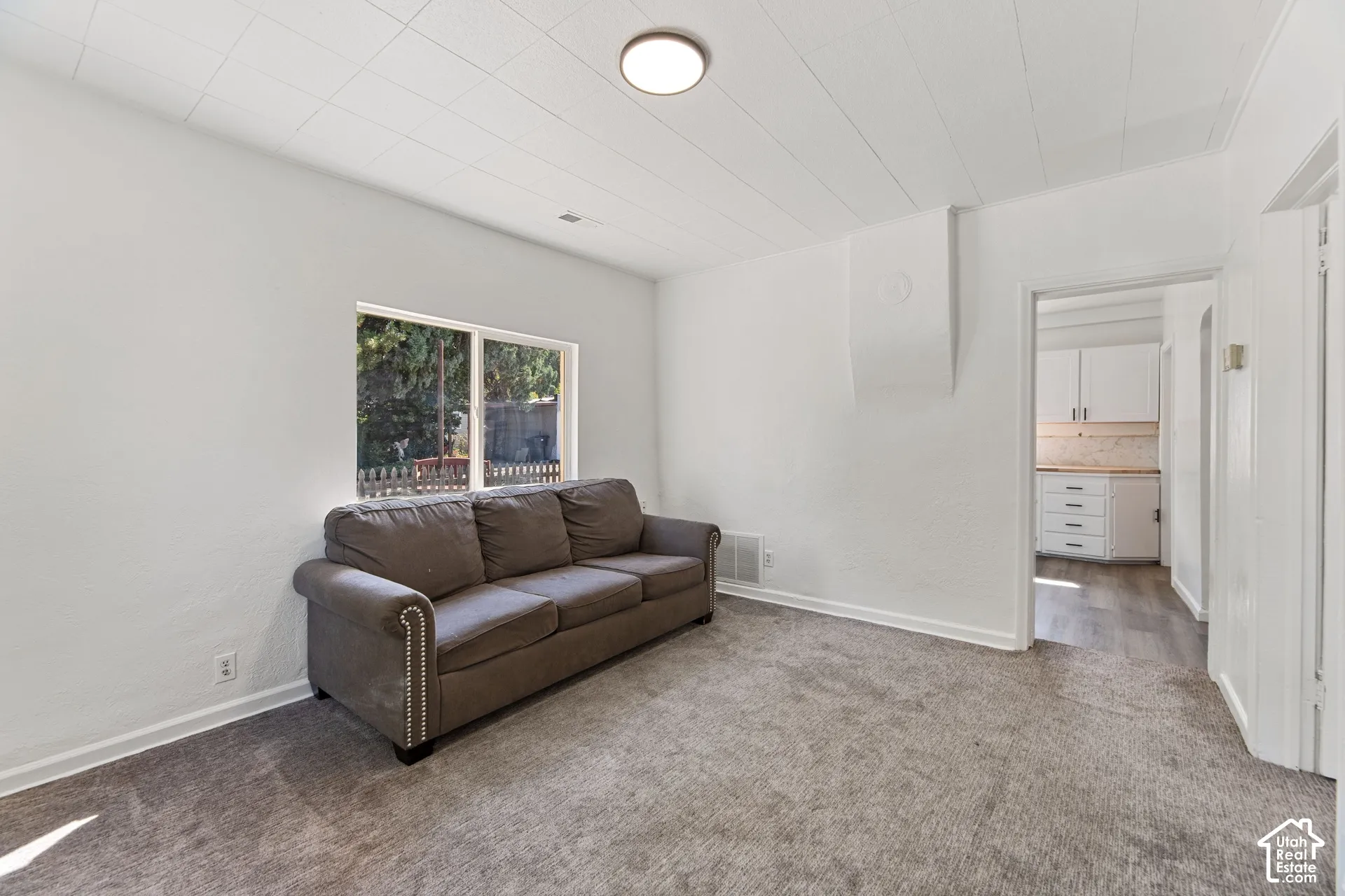 ADU Family Room with Recessed lighting, wall-to-wall carpeting, white painted walls, and a window for natural light