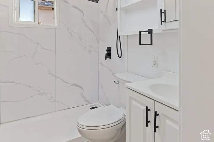 Main House Bathroom with New Walk-In Shower with large format white and gray veined wall panels