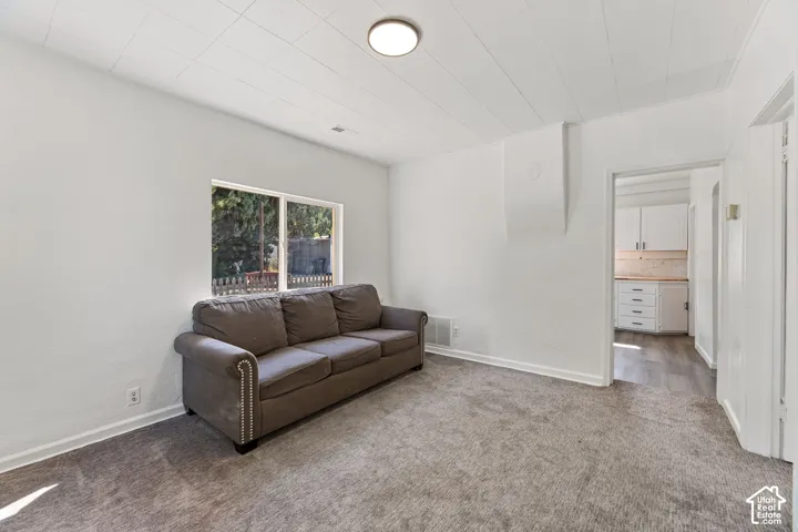 ADU Family Room with Recessed lighting, wall-to-wall carpeting, white painted walls, and a window for natural light
