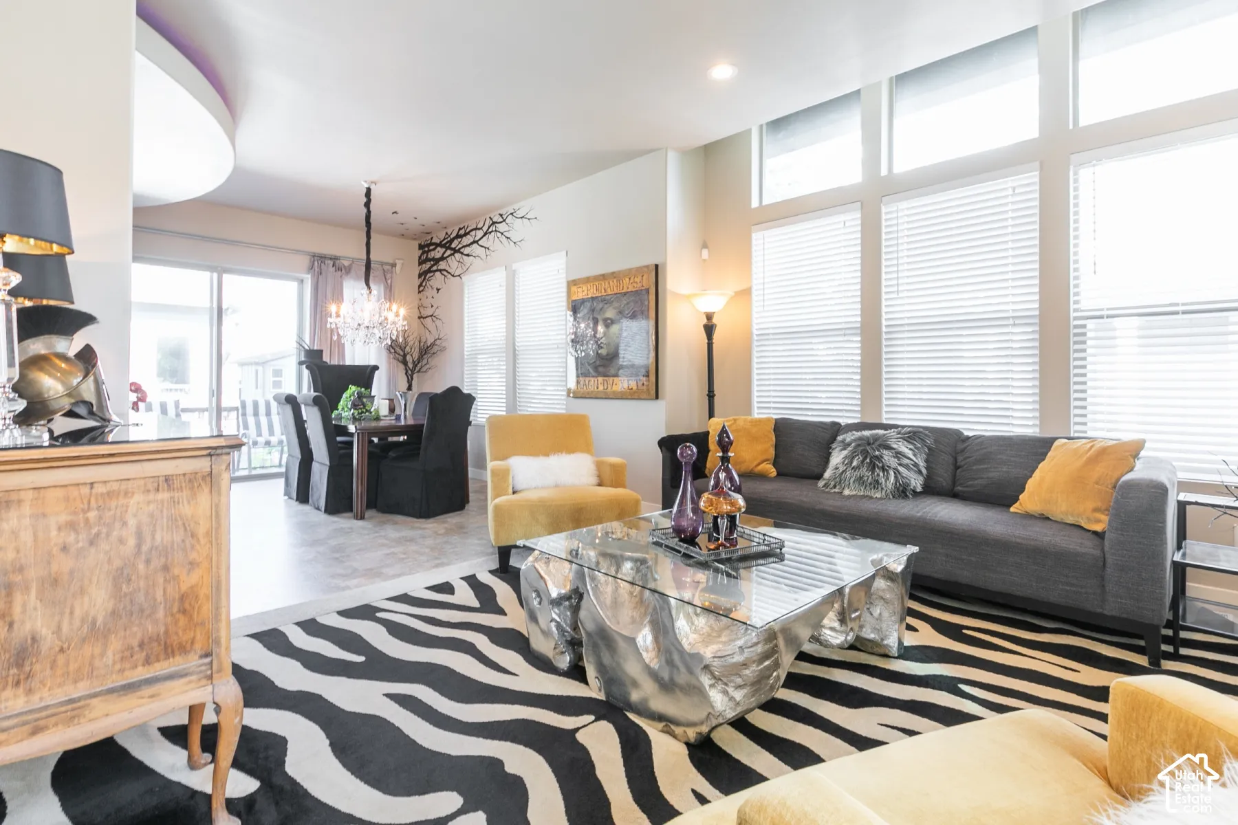 Open-concept living area with high ceilings and large windows