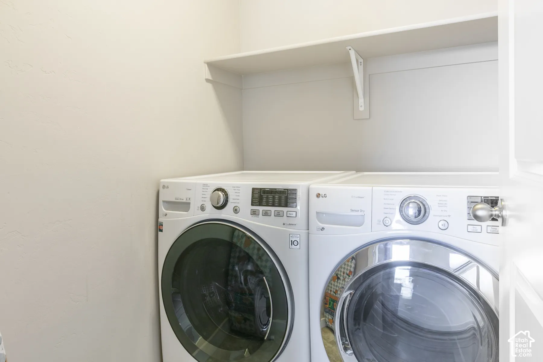 Laundry area with built-in shelving