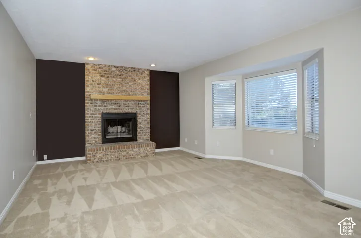 Brick fireplace with a wood mantle
