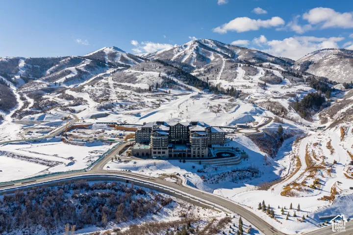 Mountainous terrain with snow-covered slopes,