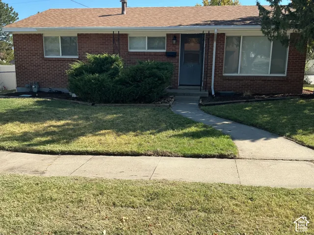Brick exterior with brown roof shingles