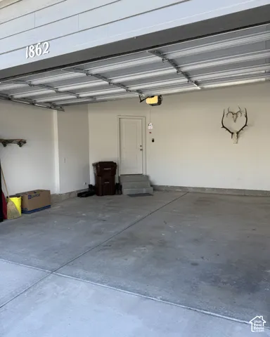 Attached garage with overhead door and automatic opener