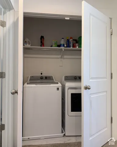 Dedicated laundry closet with built-in shelving