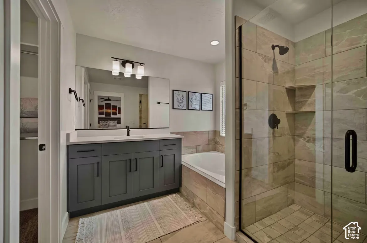 Dual vanity with shaker-style cabinetry and a quartz countertop