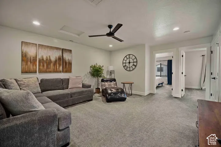 Recessed lighting, ceiling fan, and carpeted flooring
