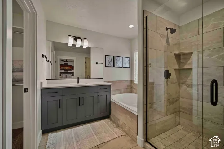 Dual vanity with shaker-style cabinetry and a quartz countertop