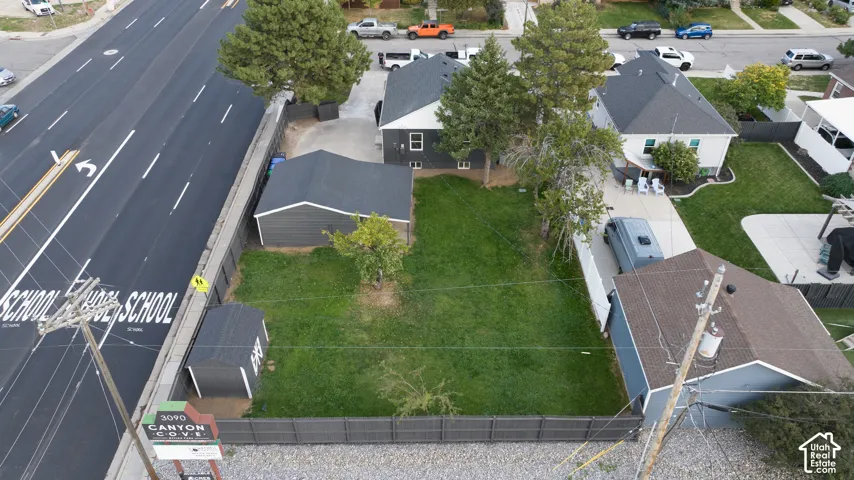 Expansive lot featuring a detached garage and a separate shed
