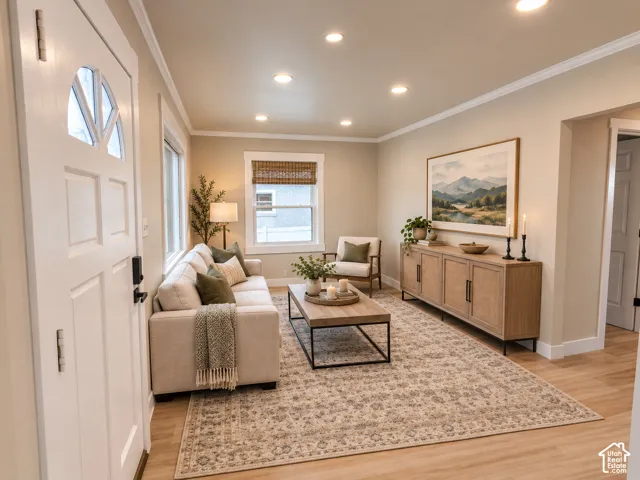 Interior space featuring recessed lighting, wood-finish flooring, crown molding, and multi-pane window