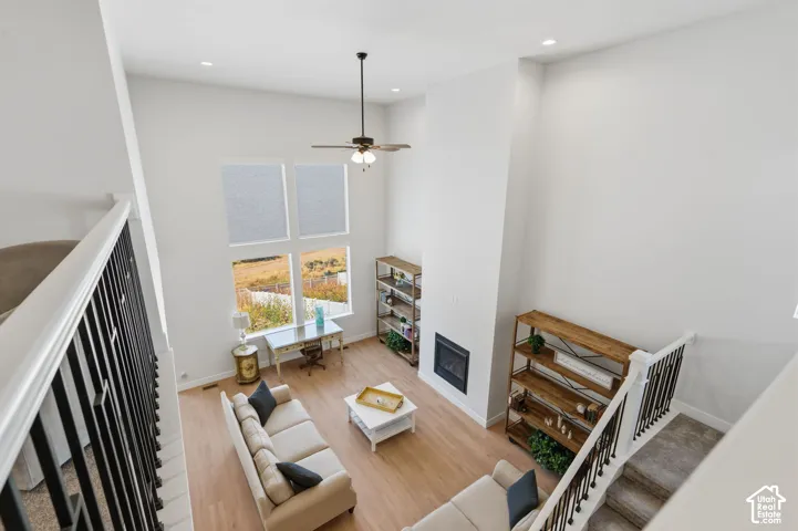 From above tall ceilings, recessed lighting, and a built-in fireplace.