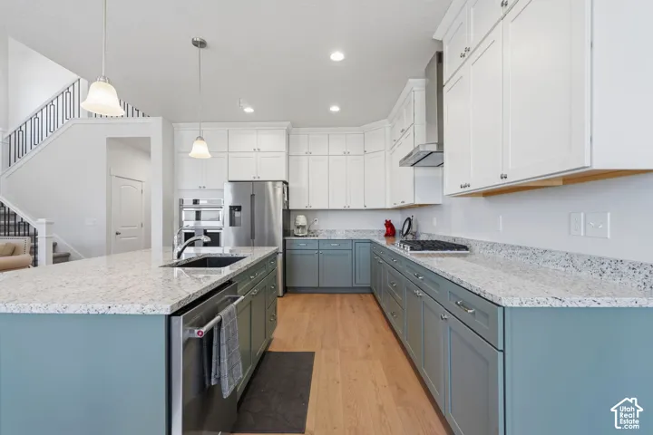 Modern kitchen featuring a U-shaped layout with white cabinetry, contrasting lower cabinets.