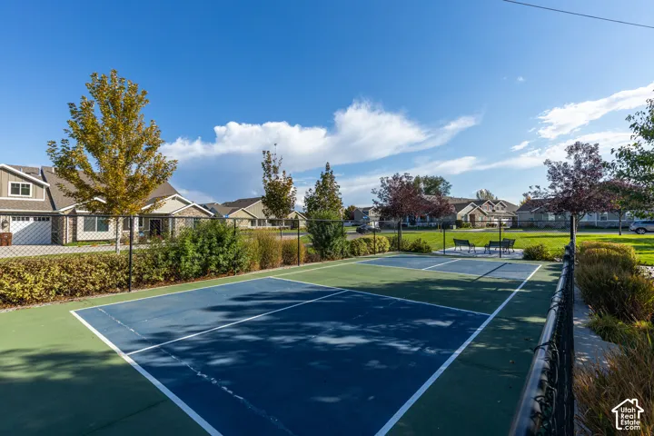 Community recreation area featuring a hard-surface court with green and blue playing zones
