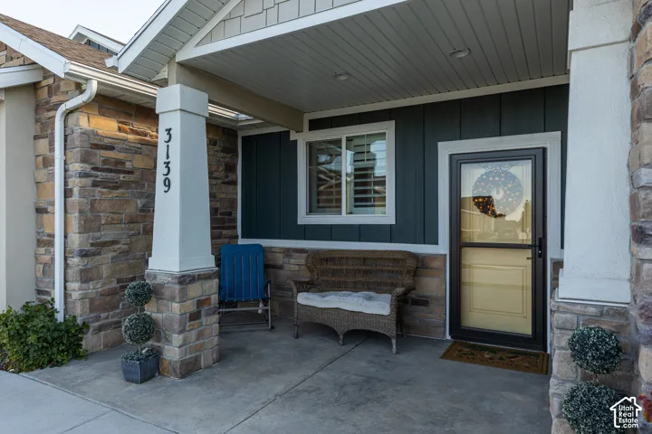 Front entry with stone veneer and board-and-batten siding