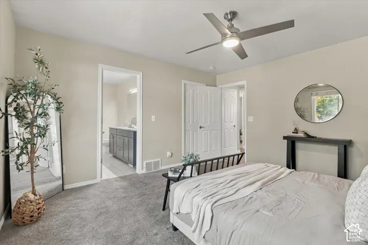 Spacious primary bedroom with neutral d