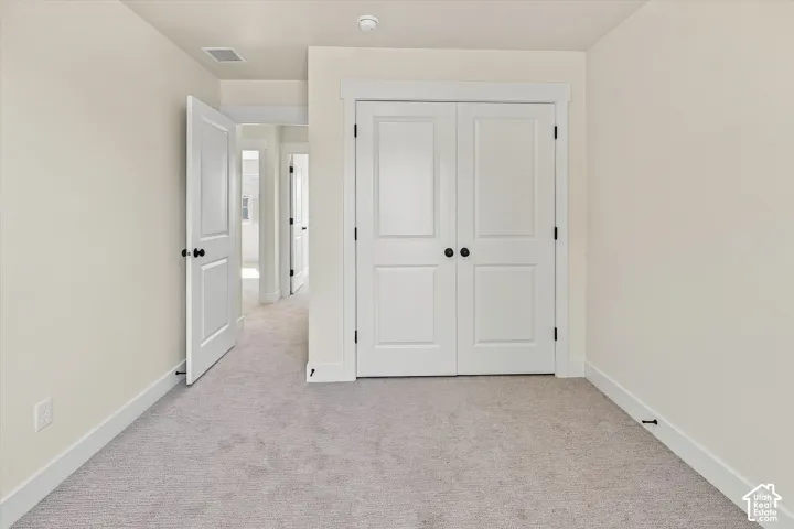 Neutral-toned carpeting throughout